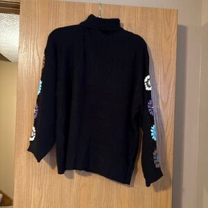 Black Turtleneck Sweater with Crochet Floral Design